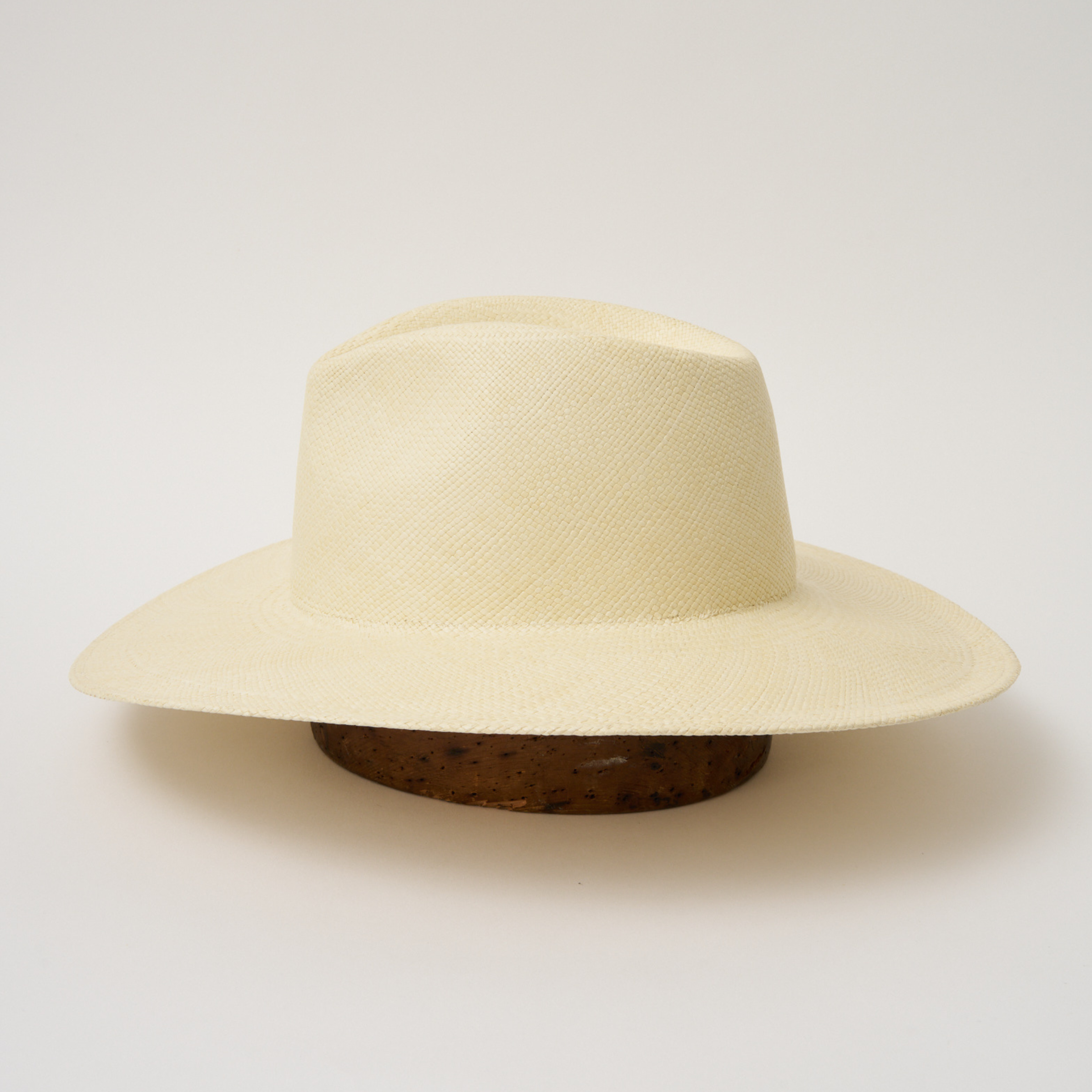 Studio image of the Camilo Oro Natural coloured Panama Hat taken from the side.