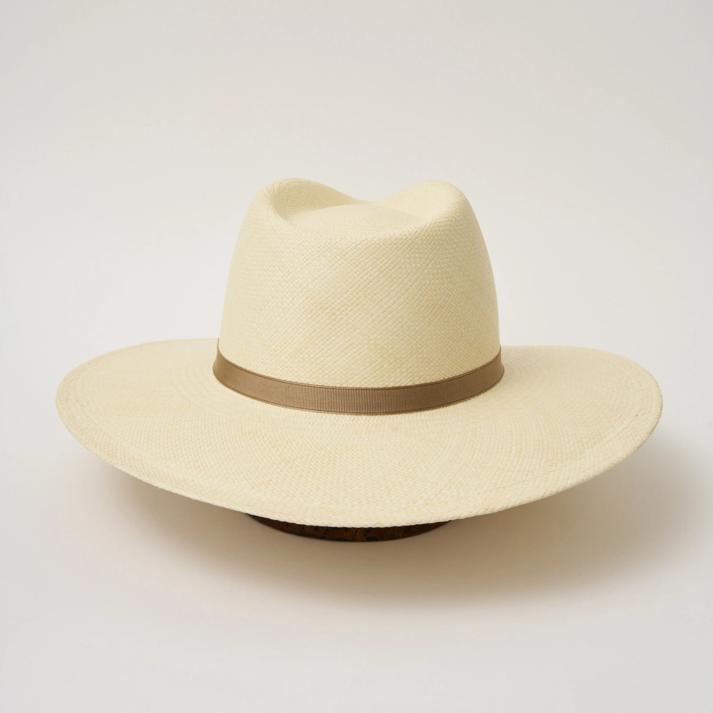 Studio image of the Camilo Oro Natural coloured Panama Hat with Taupe trim shown from the back.