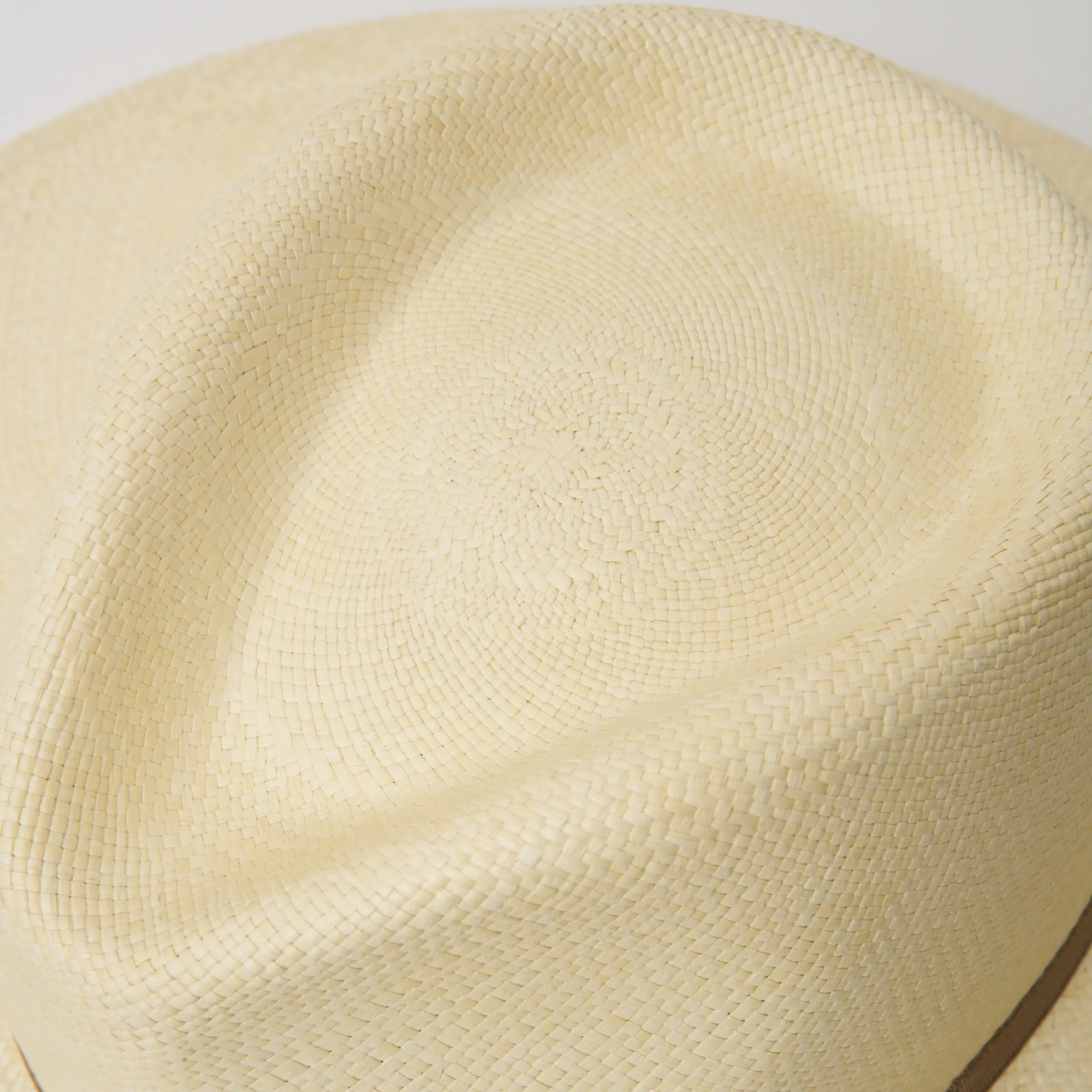 Studio closeup image of the top of the crown on the Natural/Taupe coloured Camilo Oro Panama hat.