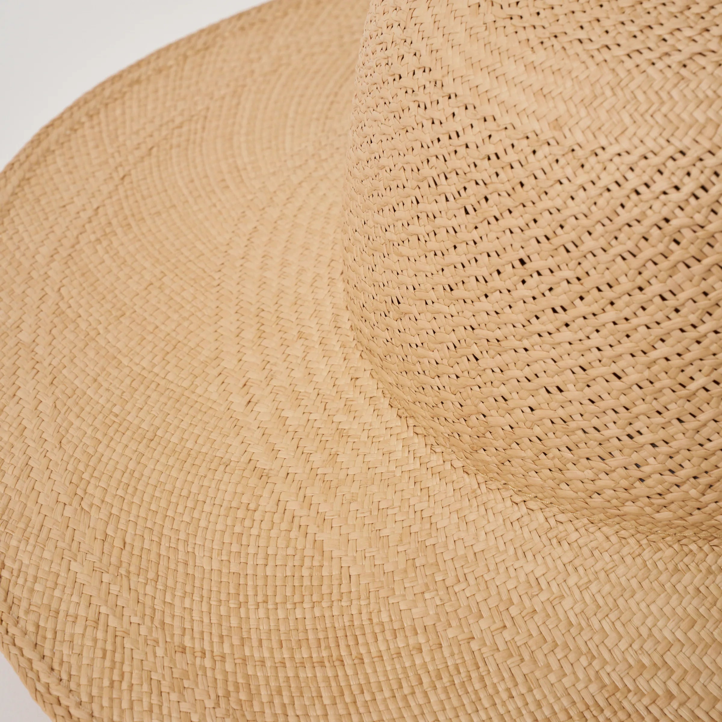 Studio image, closeup view of the Rio Sand coloured Panama Hat, showing the crochet detail on the crown.