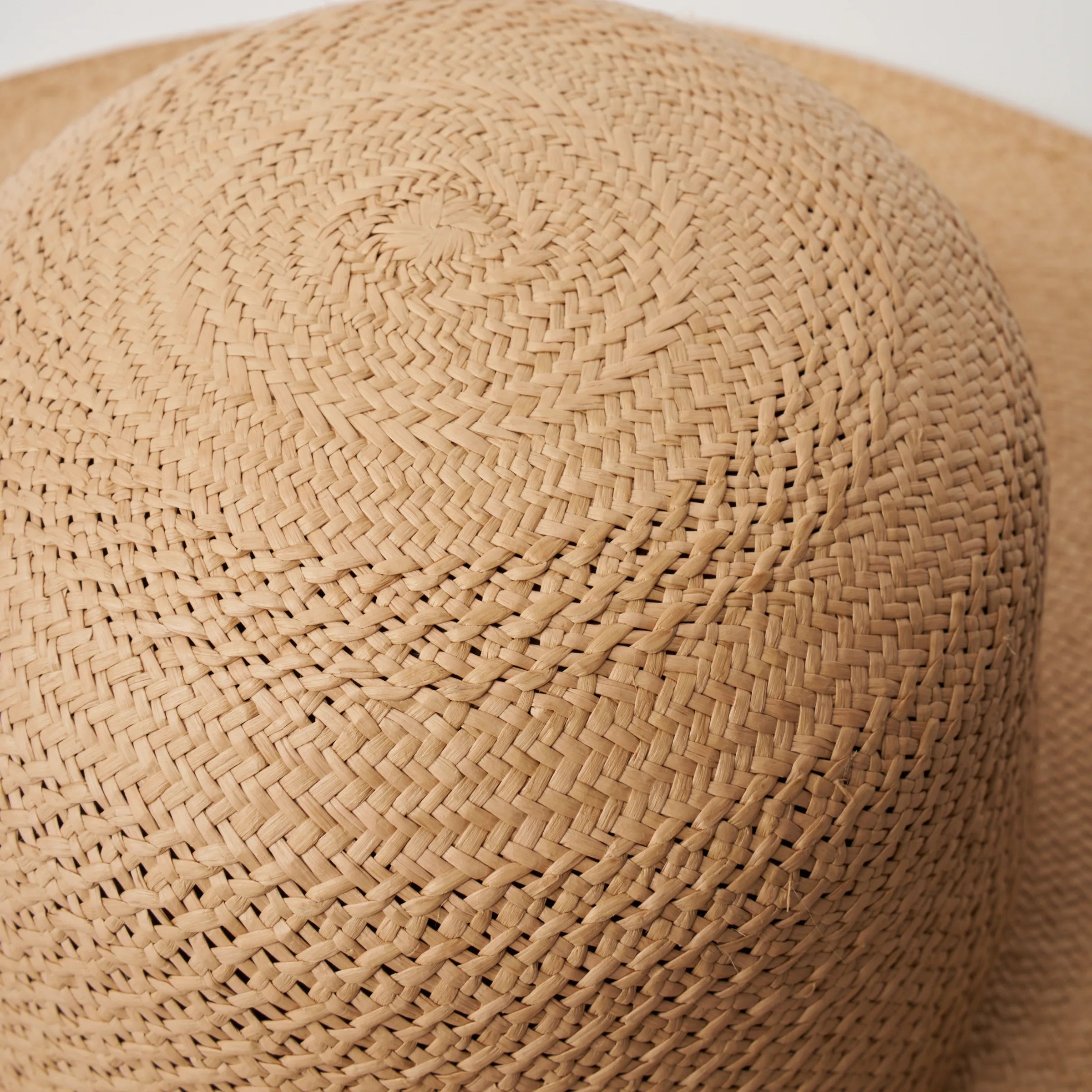 Studio image, closeup view of the Rio Sand coloured Panama Hat, showing the crochet detail at the top of the crown.