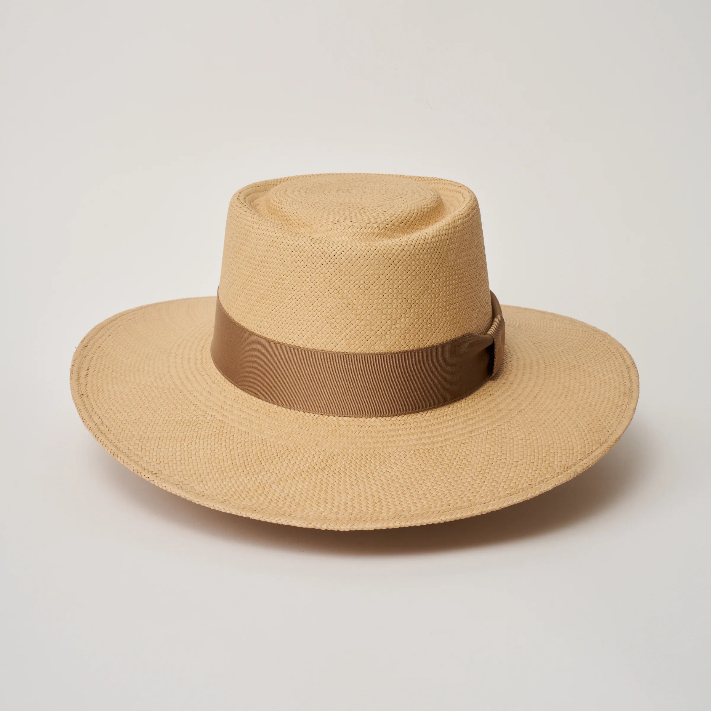 Studio image of the Camilo Sol Sand coloured Panama Hat with Tan trim taken from the front.