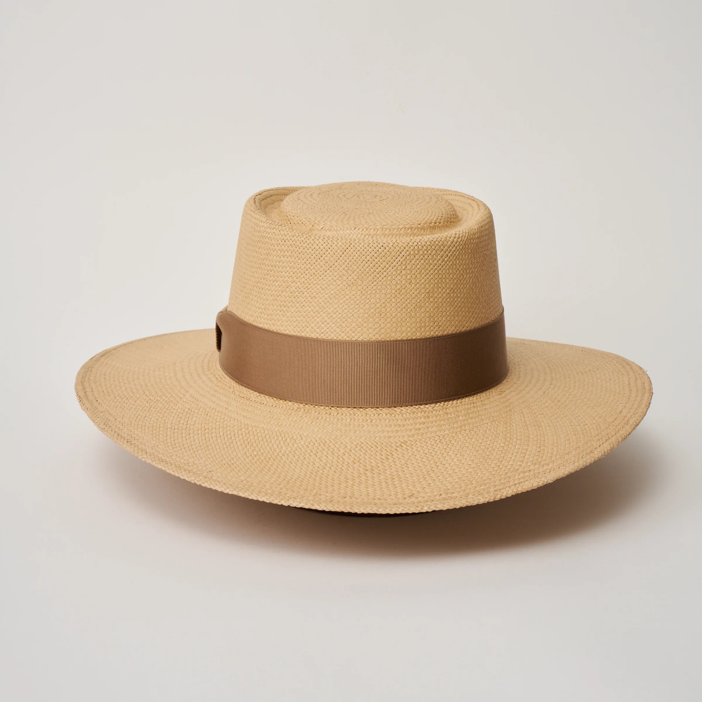 Studio image of the Camilo Sol Sand coloured Panama Hat with Tan trim taken from the back.
