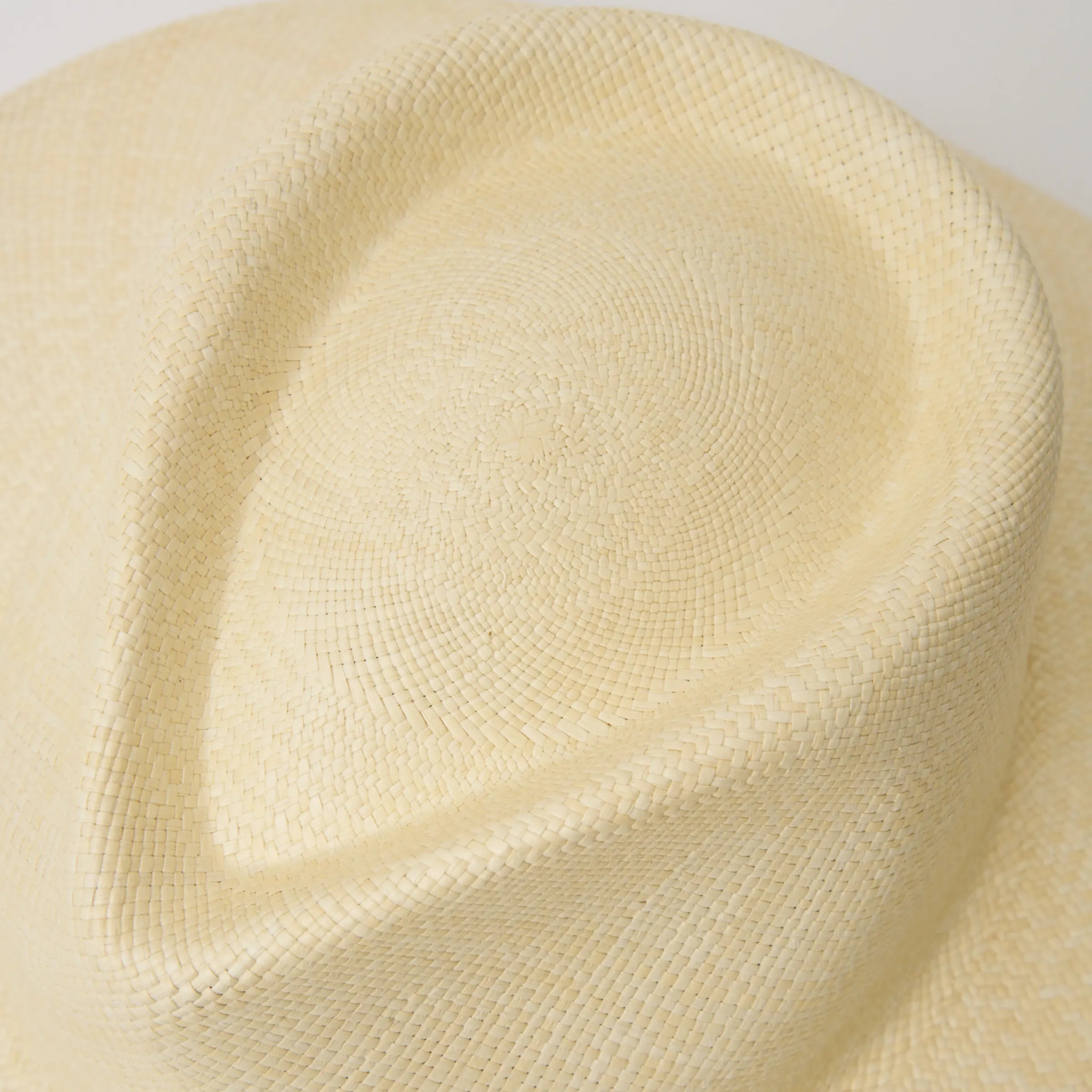 Studio closeup image of the top of the crown on the Natural coloured Camilo Vita Panama hat.