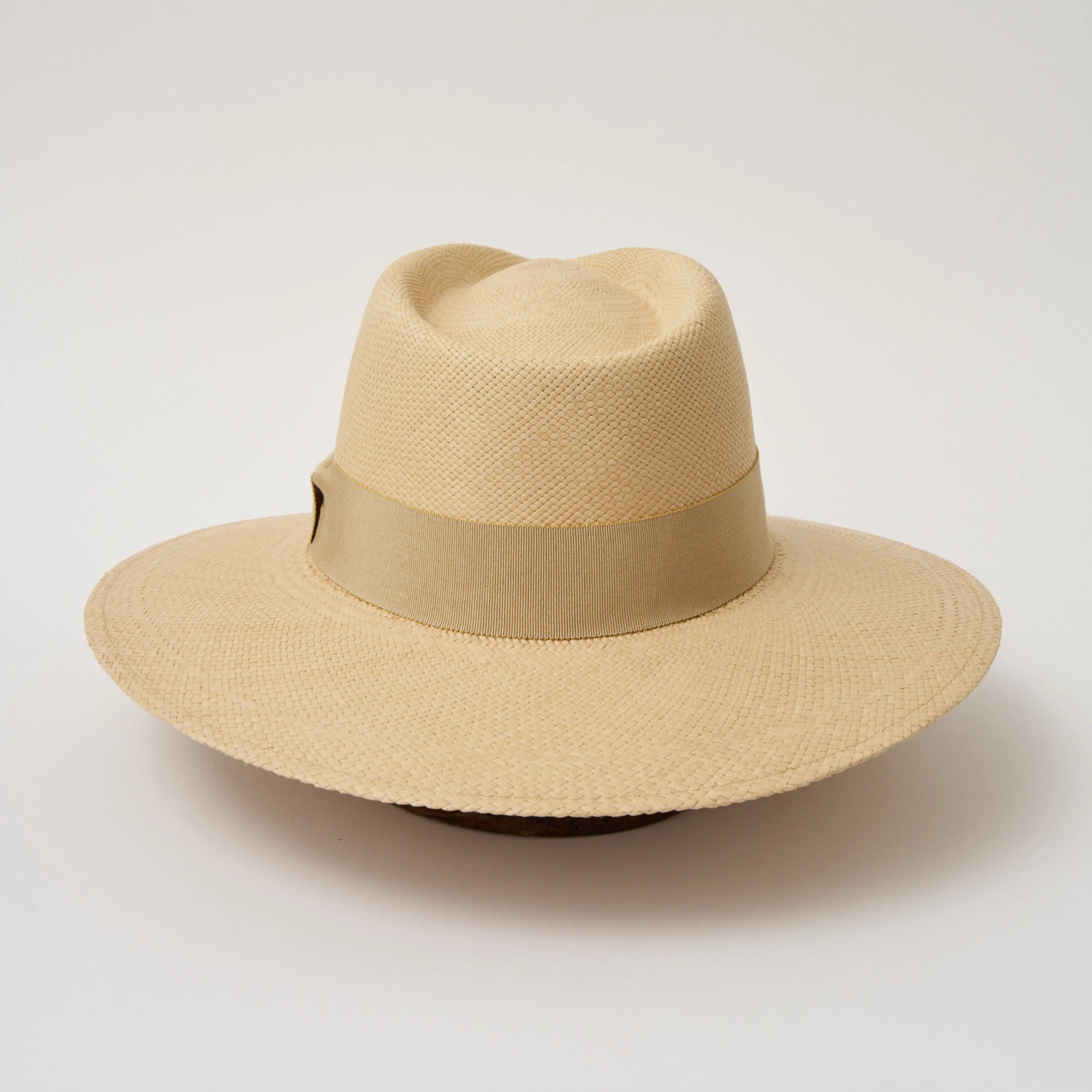 Studio image of the Camilo Vita Sand coloured Panama Hat with Camel trim shown from the back.