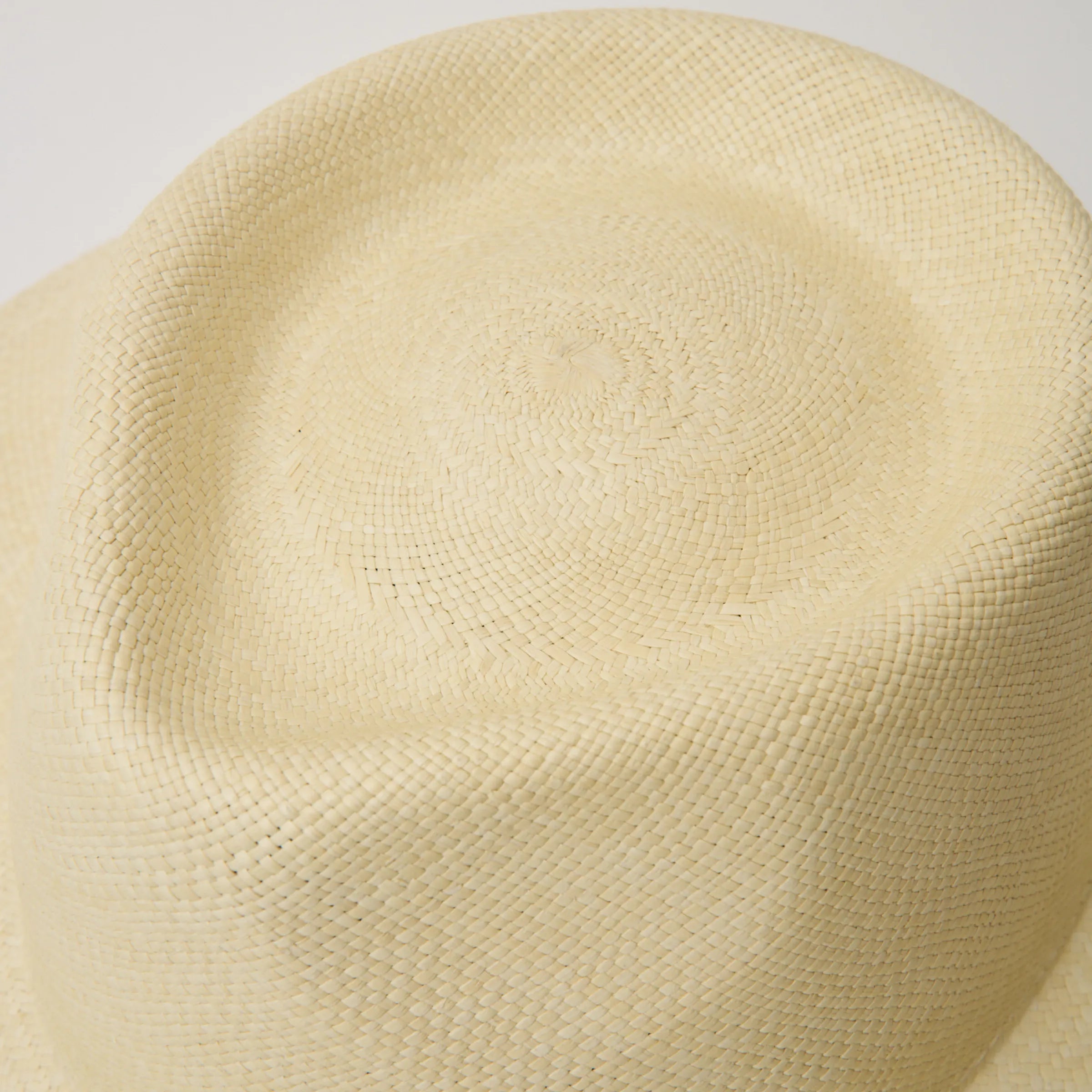 Studio closeup image of the top of the crown on the Natural coloured Camilo Country Panama hat.