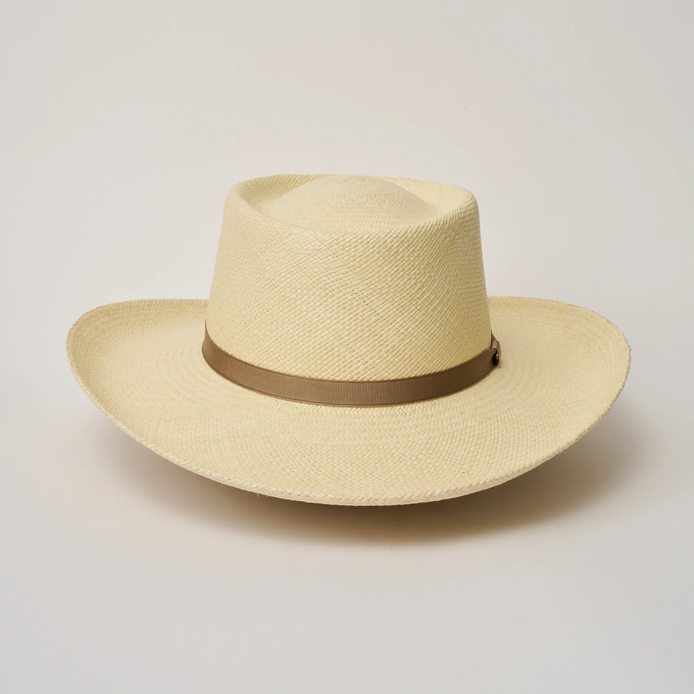 Studio image, looking top-down on the Camilo Gambler Natural coloured Panama Hat with Taupe trim, showing the crown and brim shape.