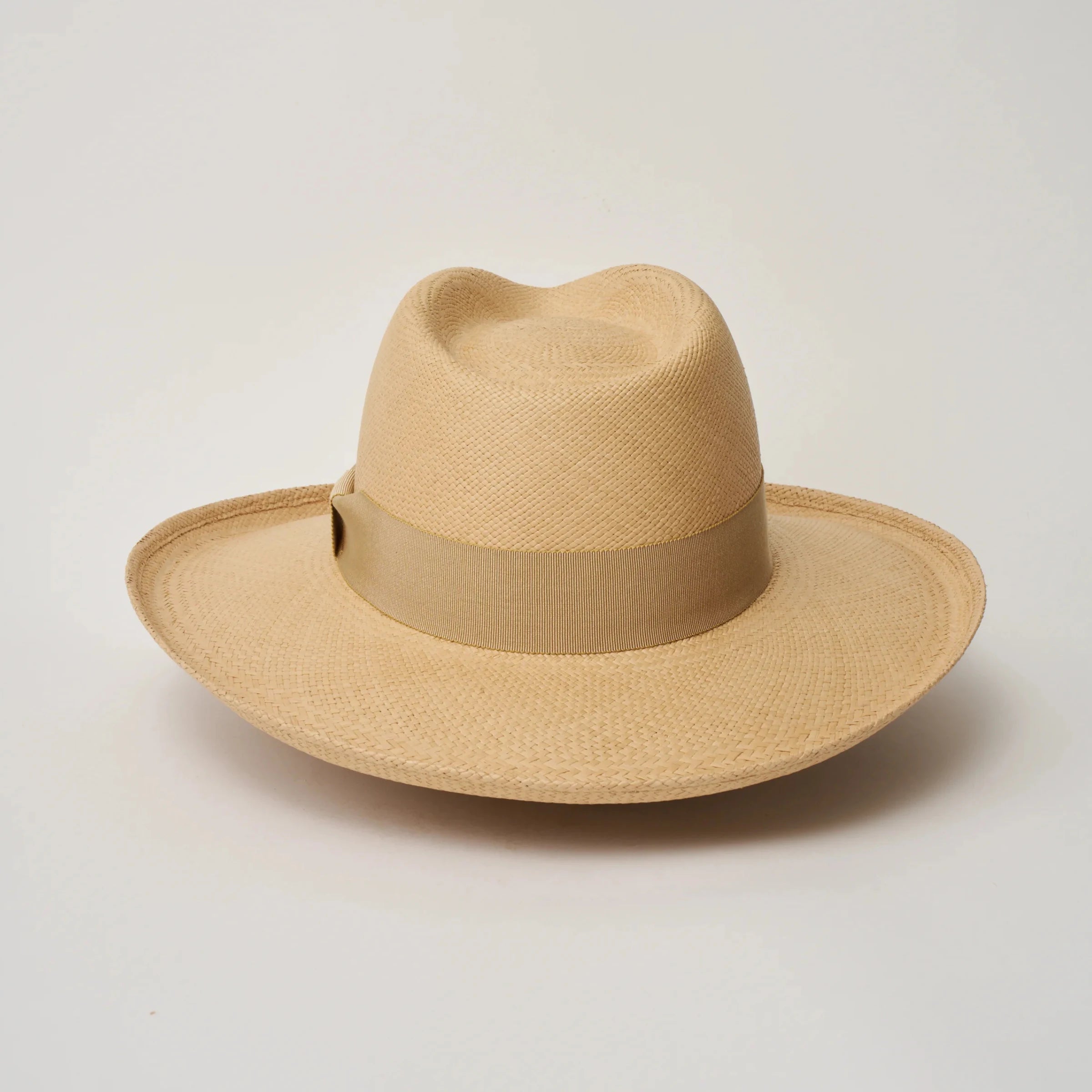 Studio image of the Camilo Grand Planter Sand coloured Panama Hat with Camel trim taken from the back.