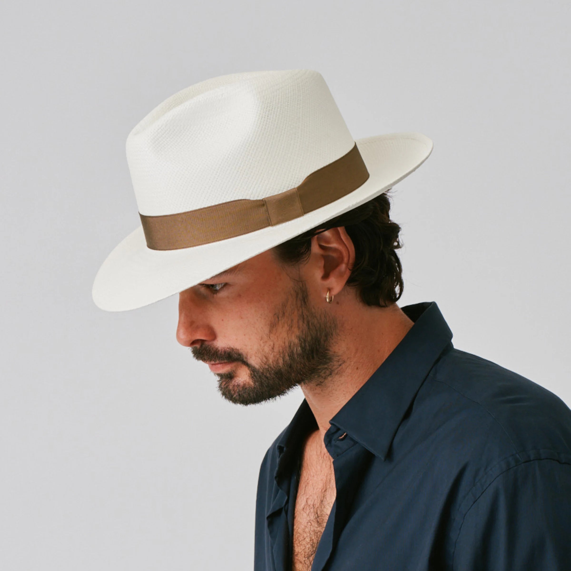 Man wearing a Camilo Classic Cream / Fawn Panama hat against a plain background.