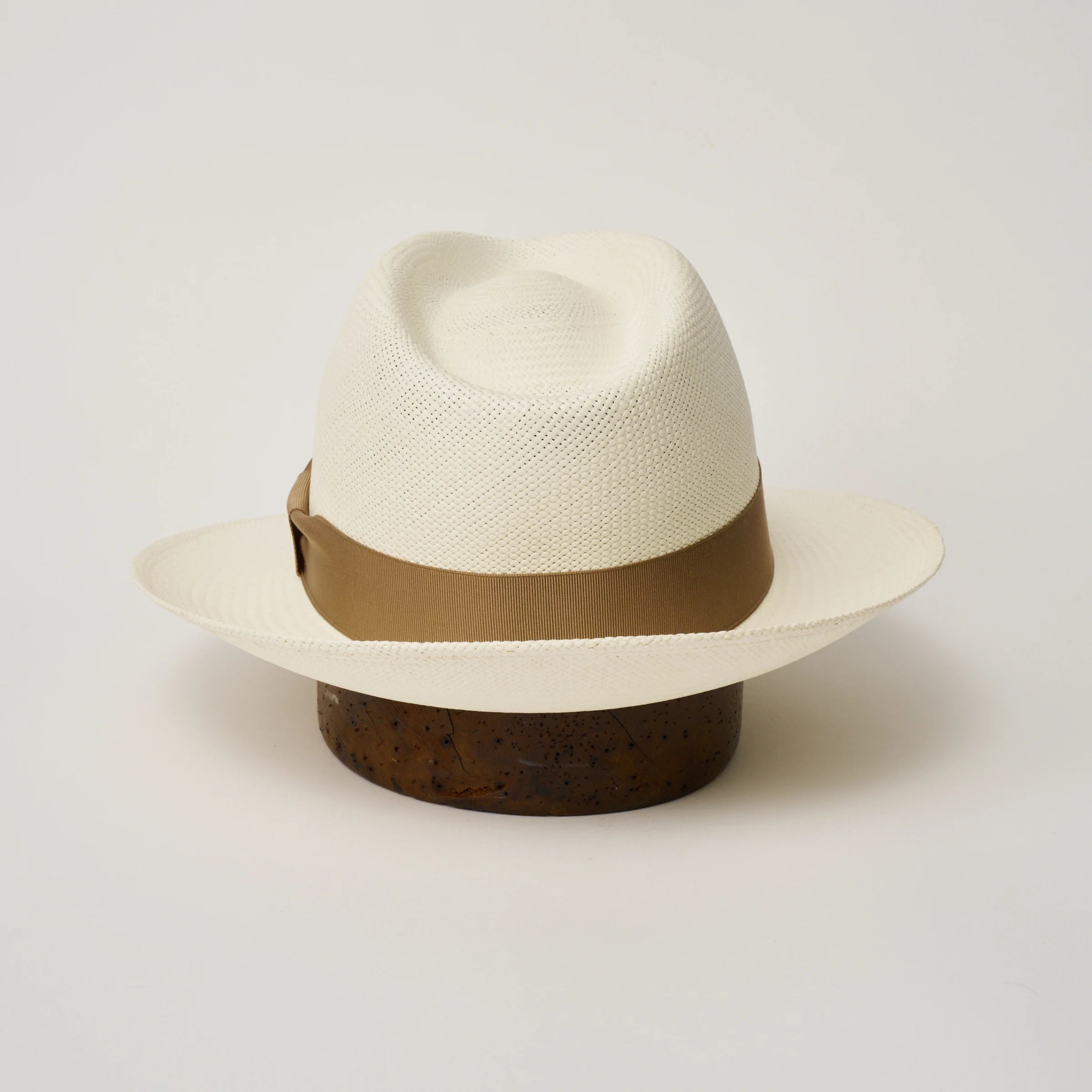 Studio image of the Camilo New Fedora Cream coloured Panama Hat with Tan trim shown from the back, showing snapback brim.