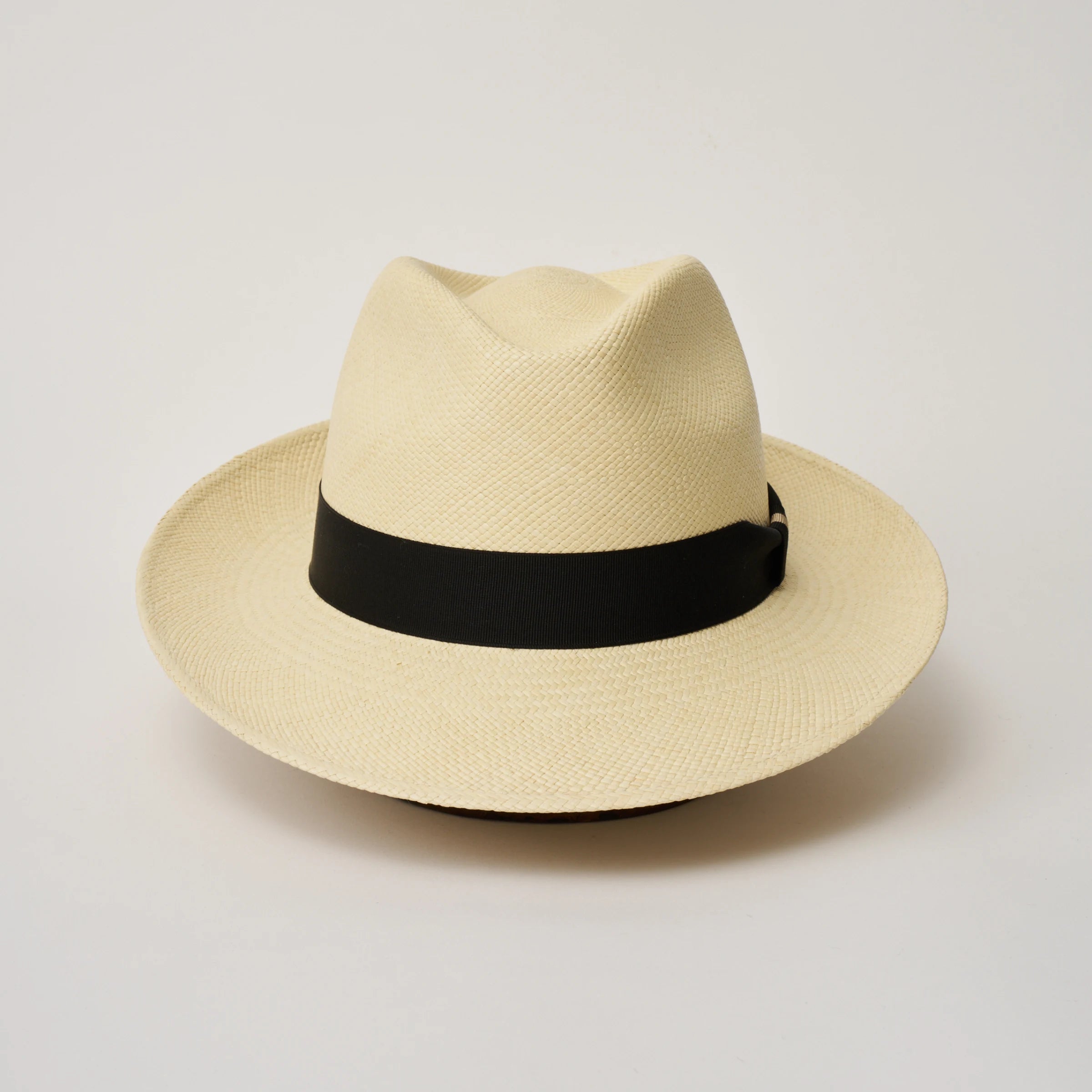 Studio image taken from the front, showing the Camilo New Fedora Natural coloured Panama Hat with Black trim.