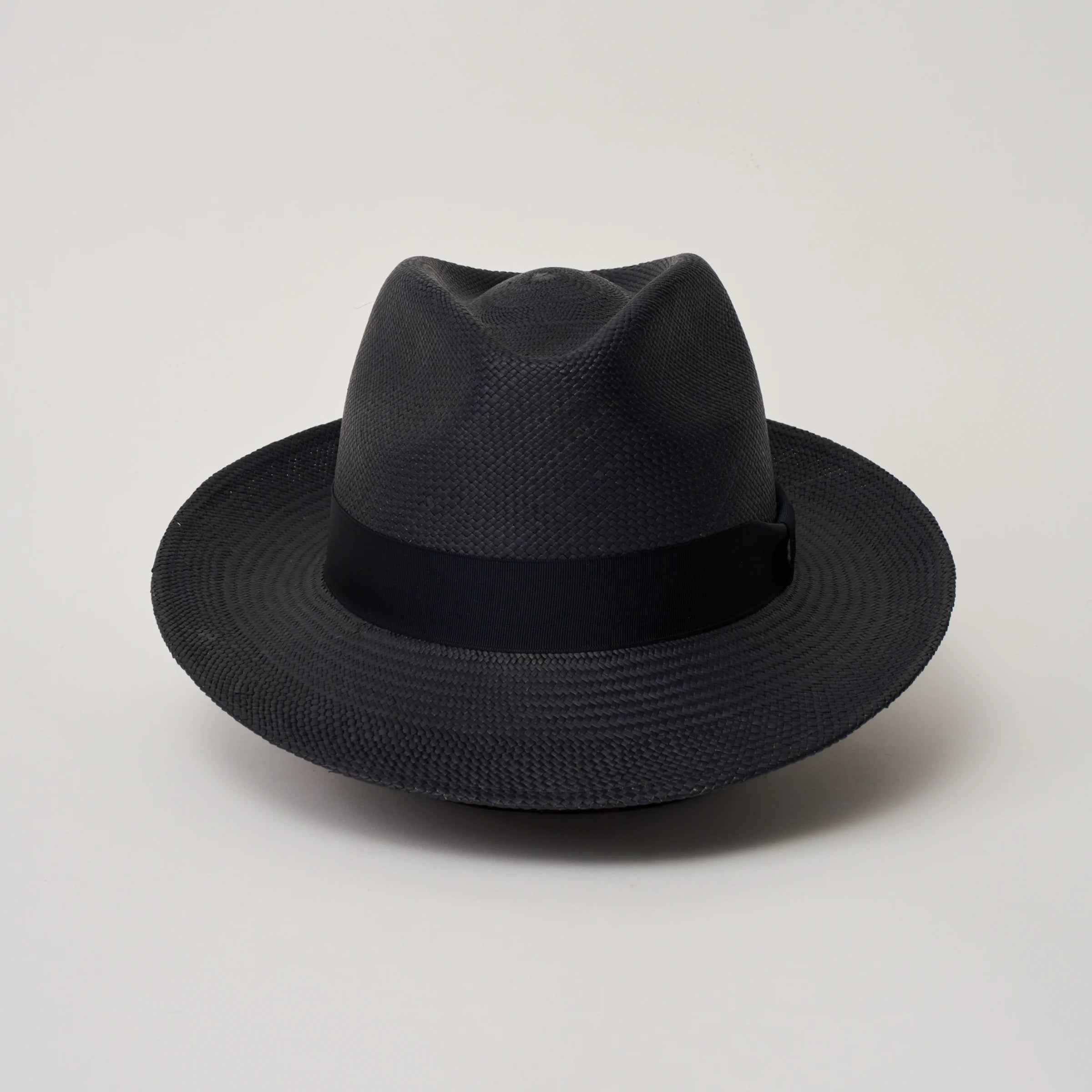 Studio image taken from the front, showing the Camilo New Fedora Navy coloured Panama Hat with Marine trim.