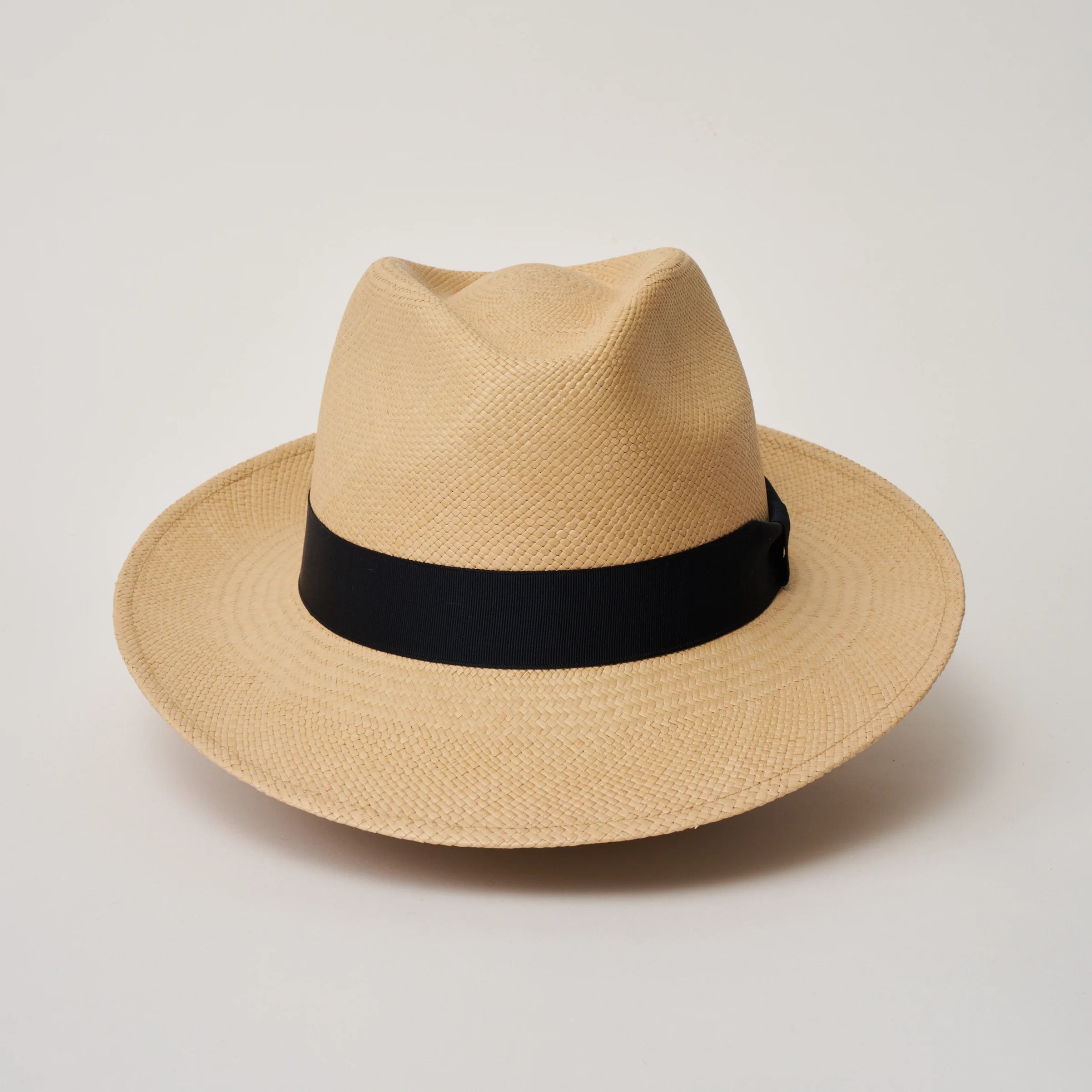 Studio image taken from the front, showing the Camilo New Fedora Sand coloured Panama Hat with Marine trim.